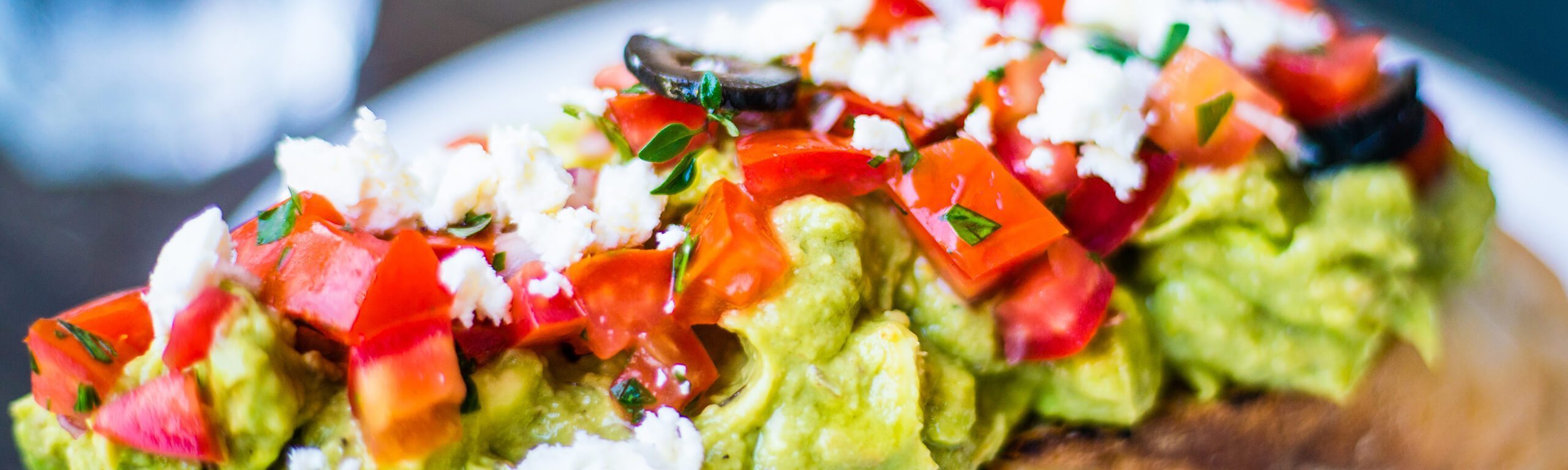 Roasted Tomatoes on Millet with Avocado and Feta Cheese